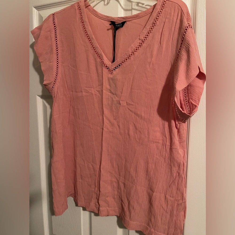 Peach color top, short sleeve never worn